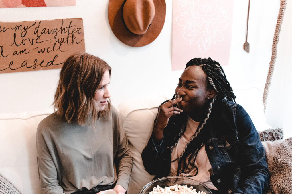 Women check-in with each other before their small group Bible study begins.